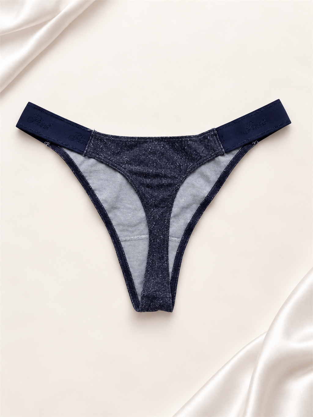 Panti azul marino liso de corte tanga, vista dorso