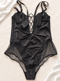 Body Negro Satinado con Tul y Espalda Cordón, vista frontal sobre fondo marfil