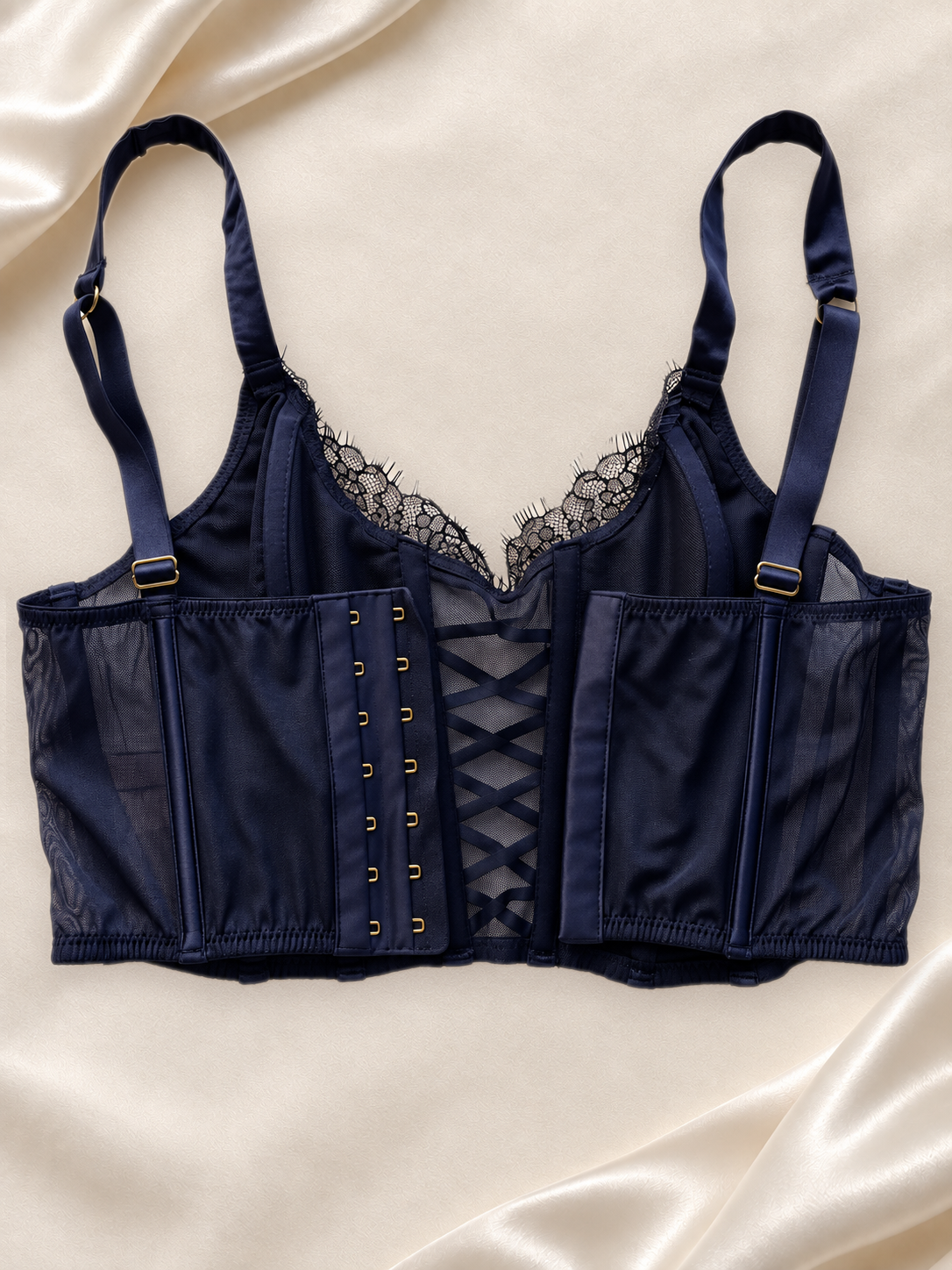 Corset V'S Azul Marino Bordado, vista dorsal sobre fondo marfil