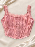 Corset V'S Rosa Satinado con Encaje, vista frontal sobre fondo marfil