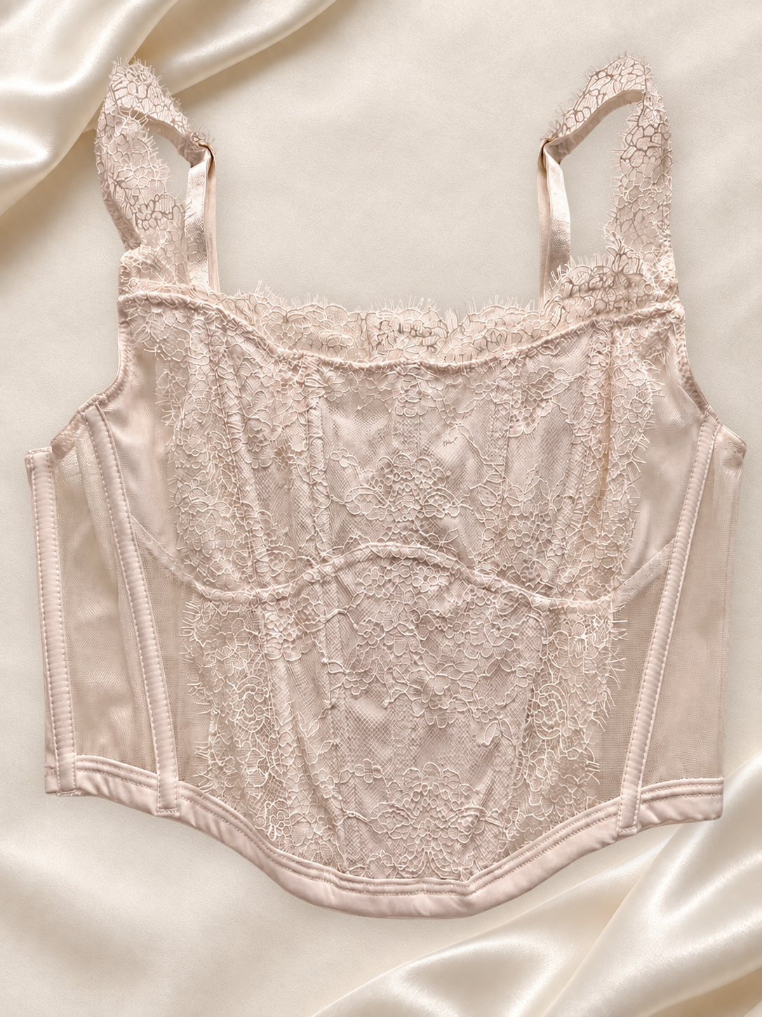 Corset Bustier de Encaje Blanco Semitransparente, vista frontal sobre fondo marfil