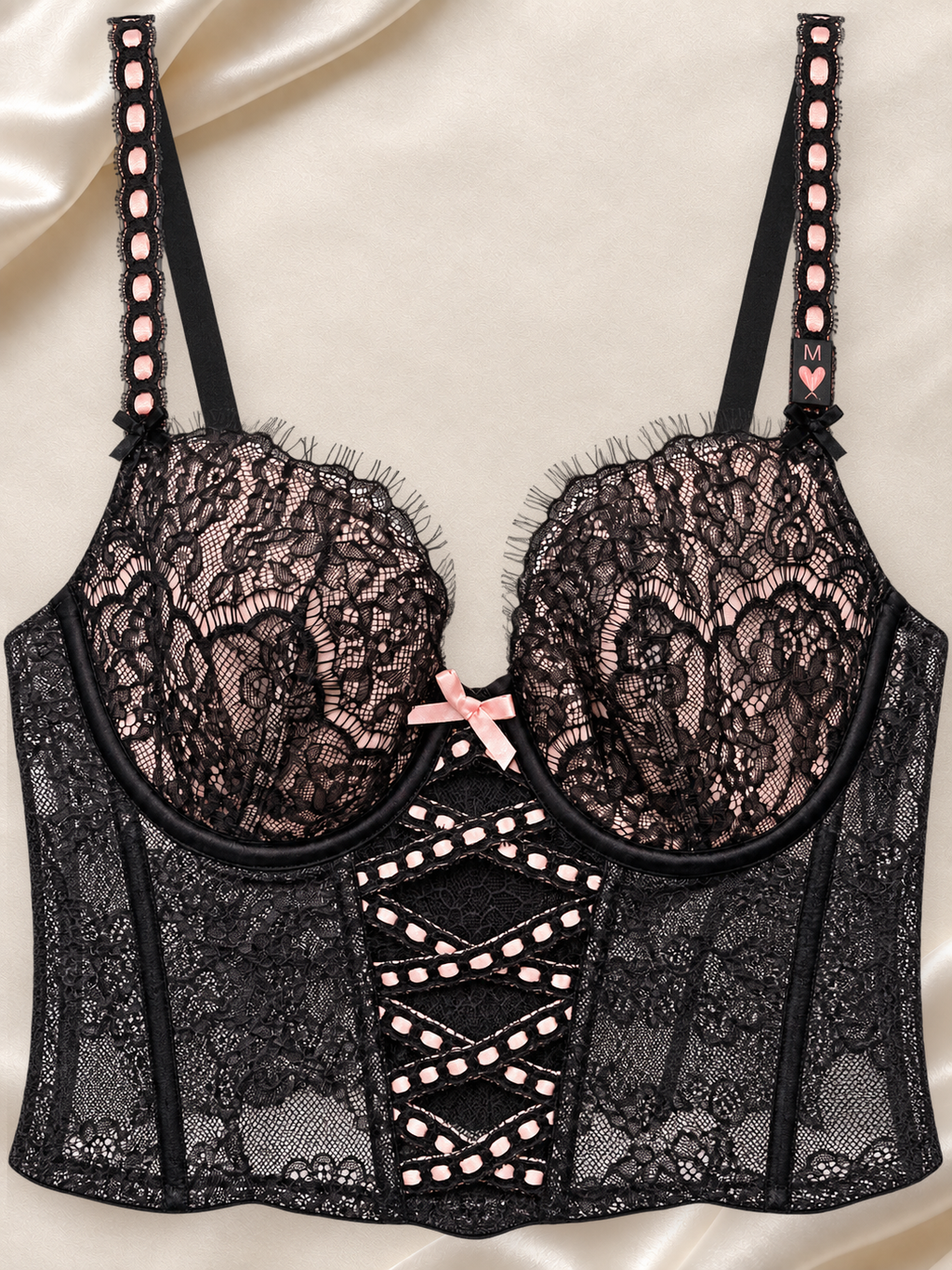 Bustier Negro de Encaje con Aro y Detalle Cruzado, vista frontal sobre fondo marfil