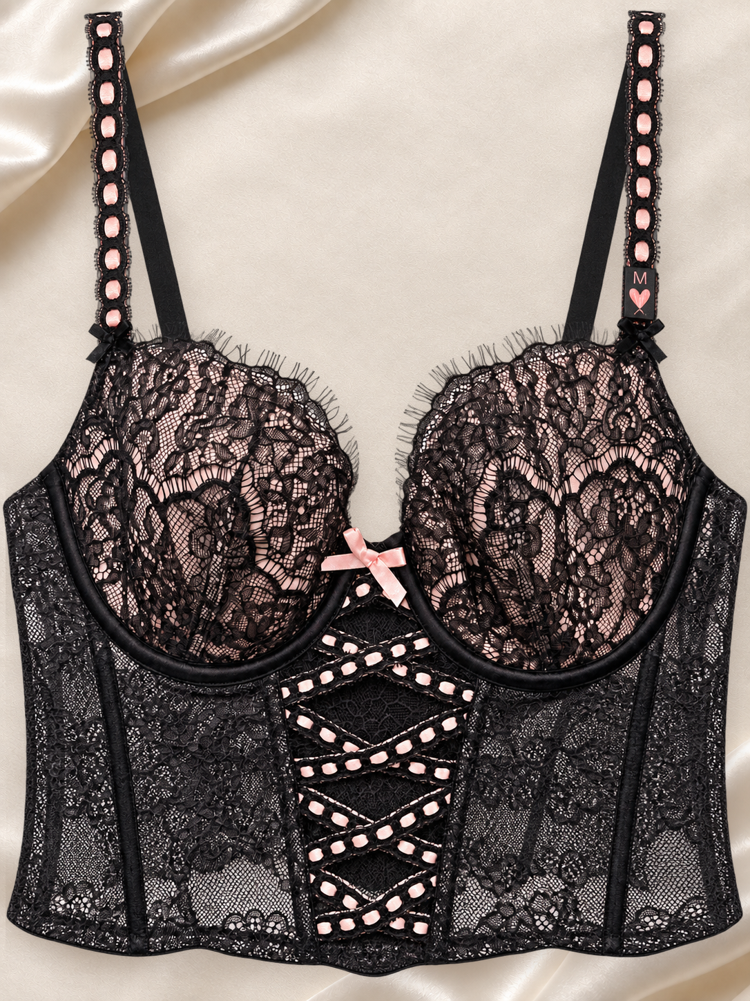 Bustier Negro de Encaje con Aro y Detalle Cruzado, vista frontal sobre fondo marfil