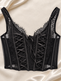 Corset Bustier Negro de Encaje con Detalles Cruzados, vista frontal sobre fondo marfil
