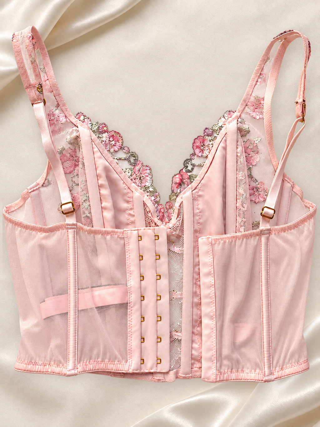 Corset V'S Floral Rosa de Tul con Lazo Satinado, vista dorsal sobre fondo marfil