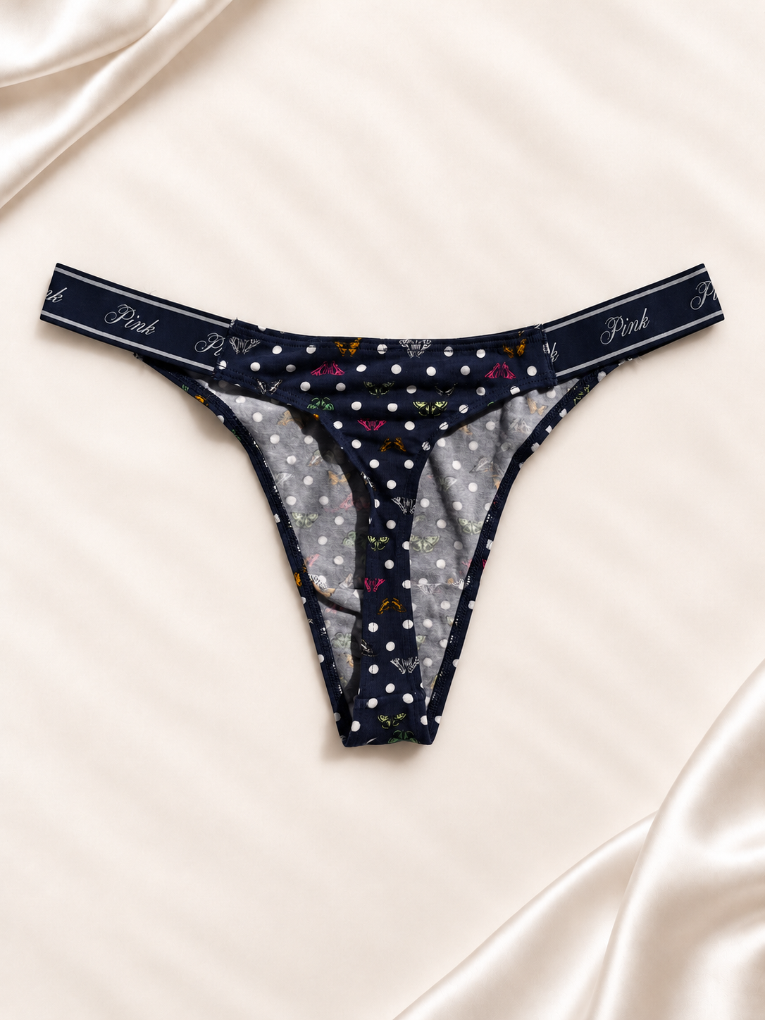 Dorso de Panti PINK azul marino con lunares de colores