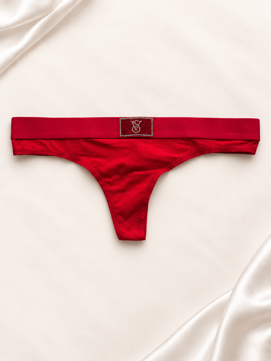 Panti V'S Rojo liso con detalle de logo, vista frontal