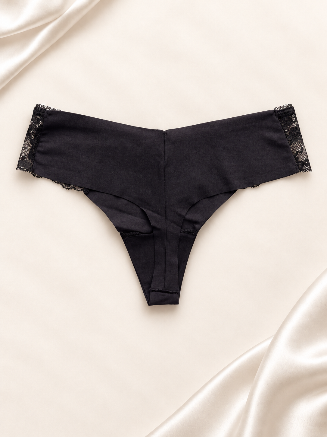 Panti V'S Negro liso con laterales de encaje, dorso