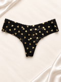 Panti V'S Negro con corazones dorados de corte tanga, frente