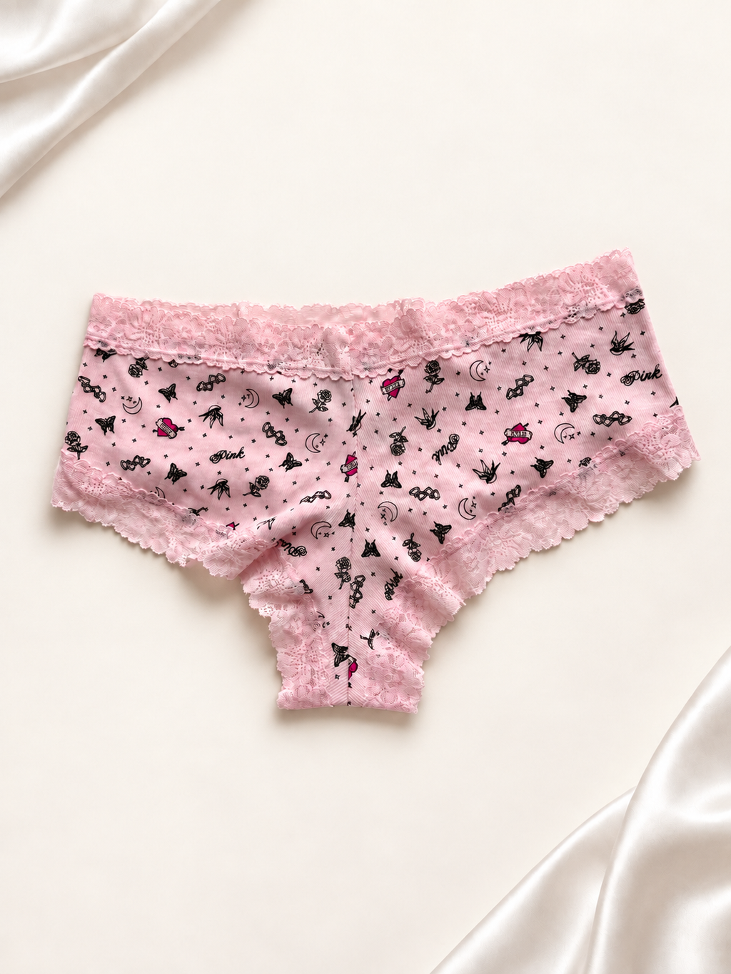 Panti V'S Rosa con Estampado Mini y Encaje, vista dorsal sobre fondo marfil