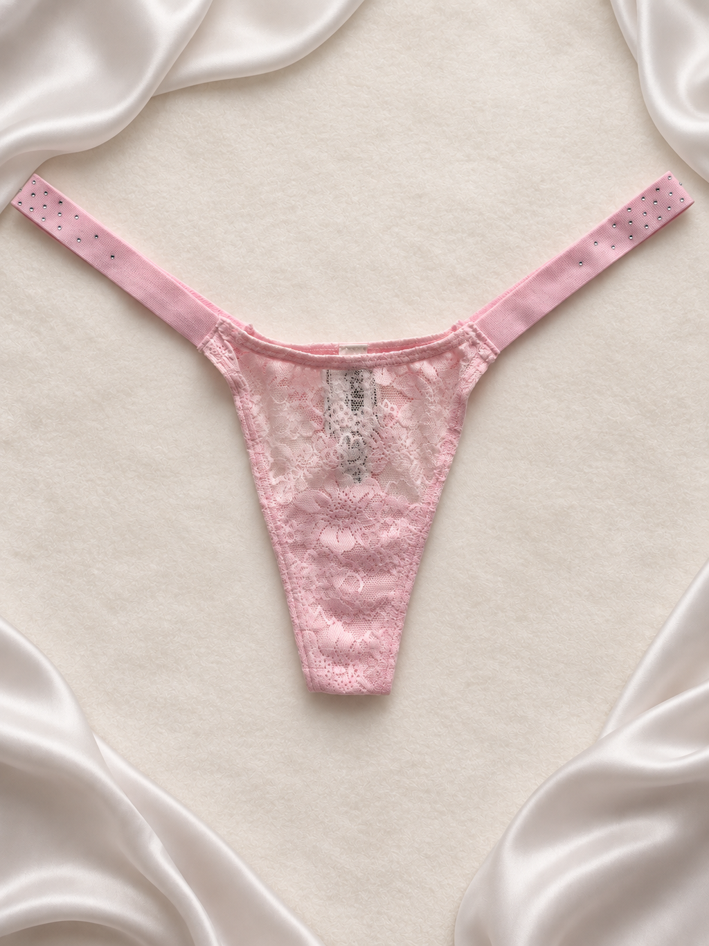 Panti rosa pastel de encaje, vista frontal