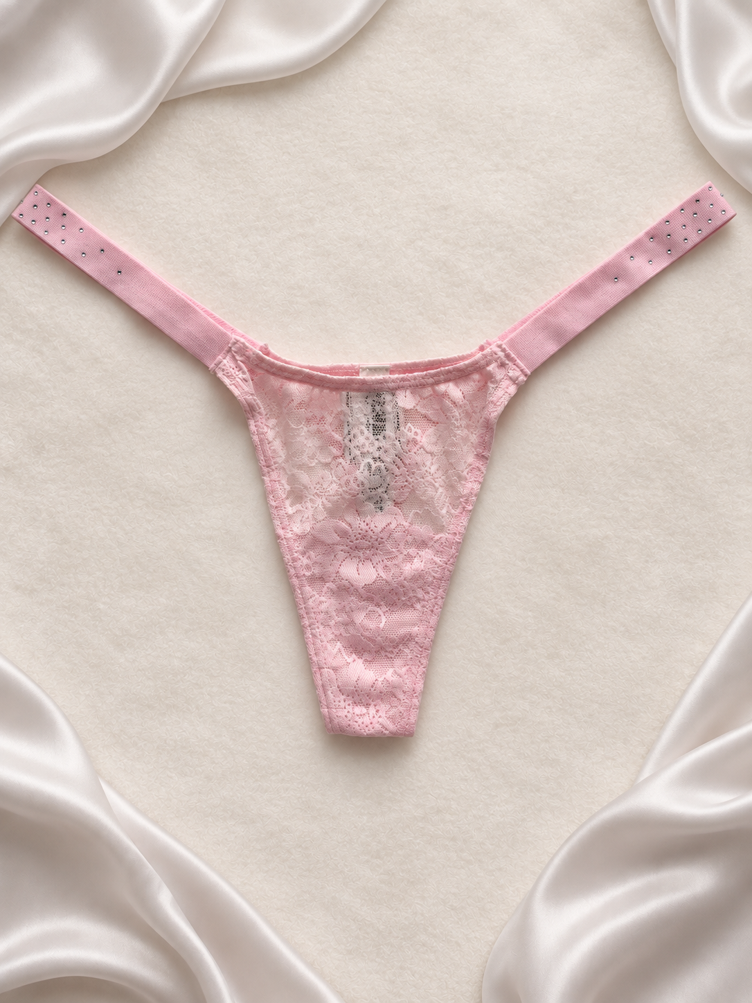 Panti rosa pastel de encaje, vista frontal