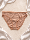 Panti beige de algodón con encaje, frente
