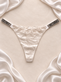 Panti V'S de encaje blanco con tiras de strass, frente