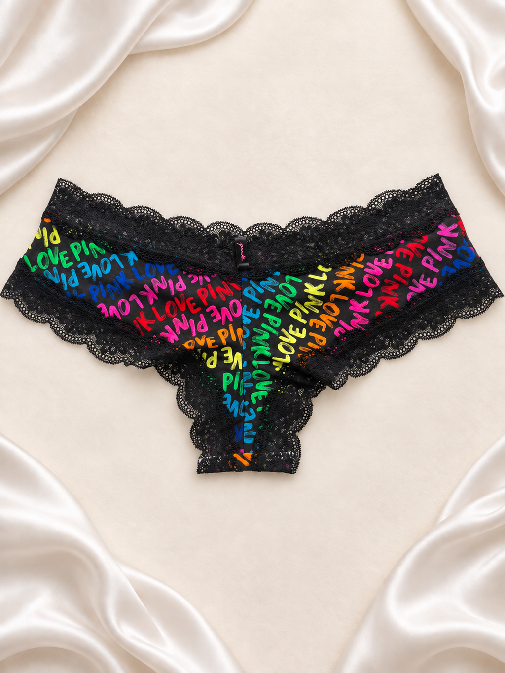 Panti negro de encaje con estampado multicolor, dorso