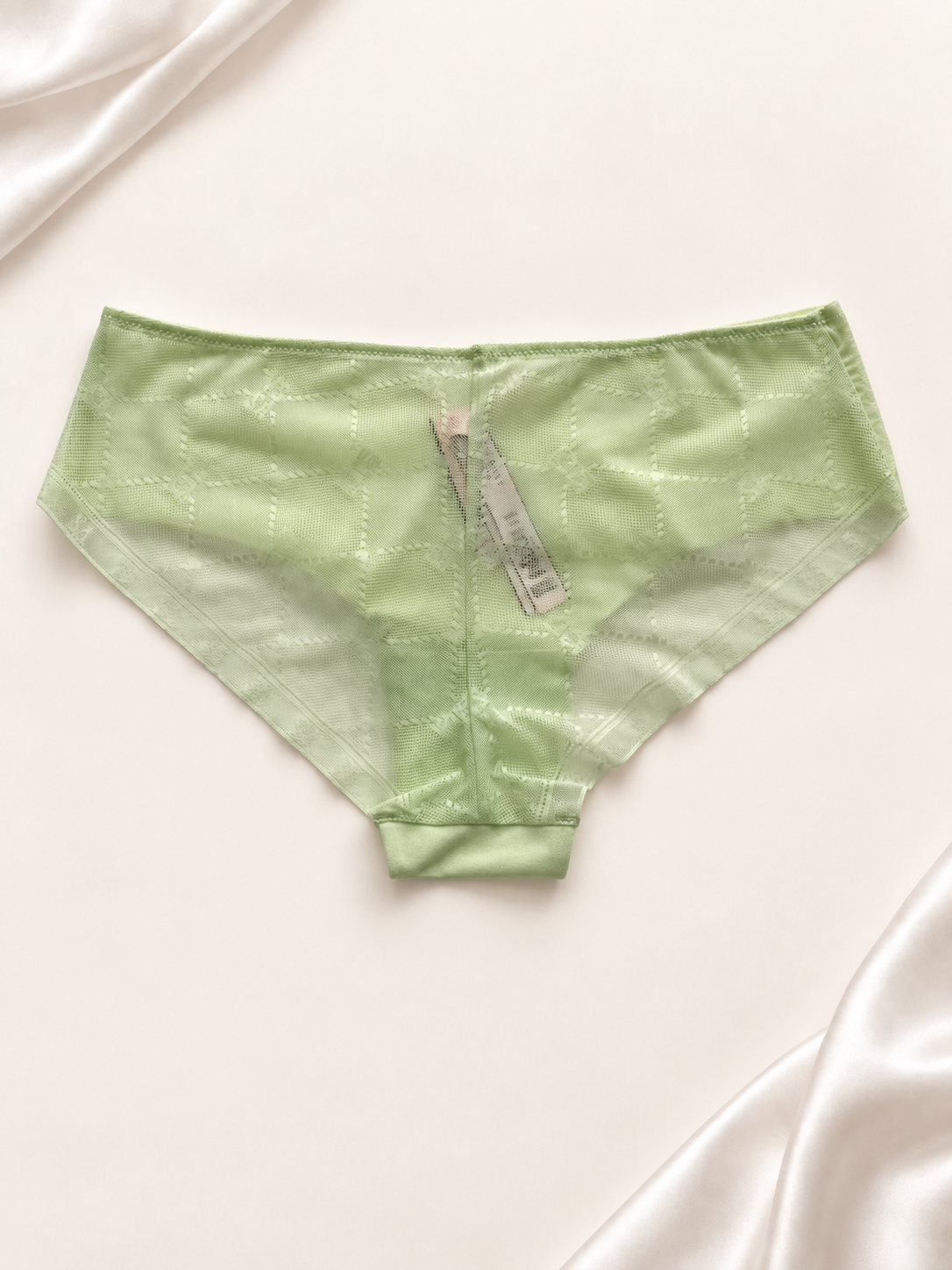 Panti verde claro de corte clásico, vista dorso